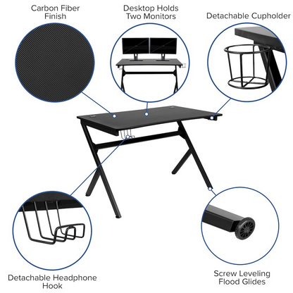 Black gaming desk with a green and black racing chair from Start2Finish, designed for gaming and ergonomic comfort.