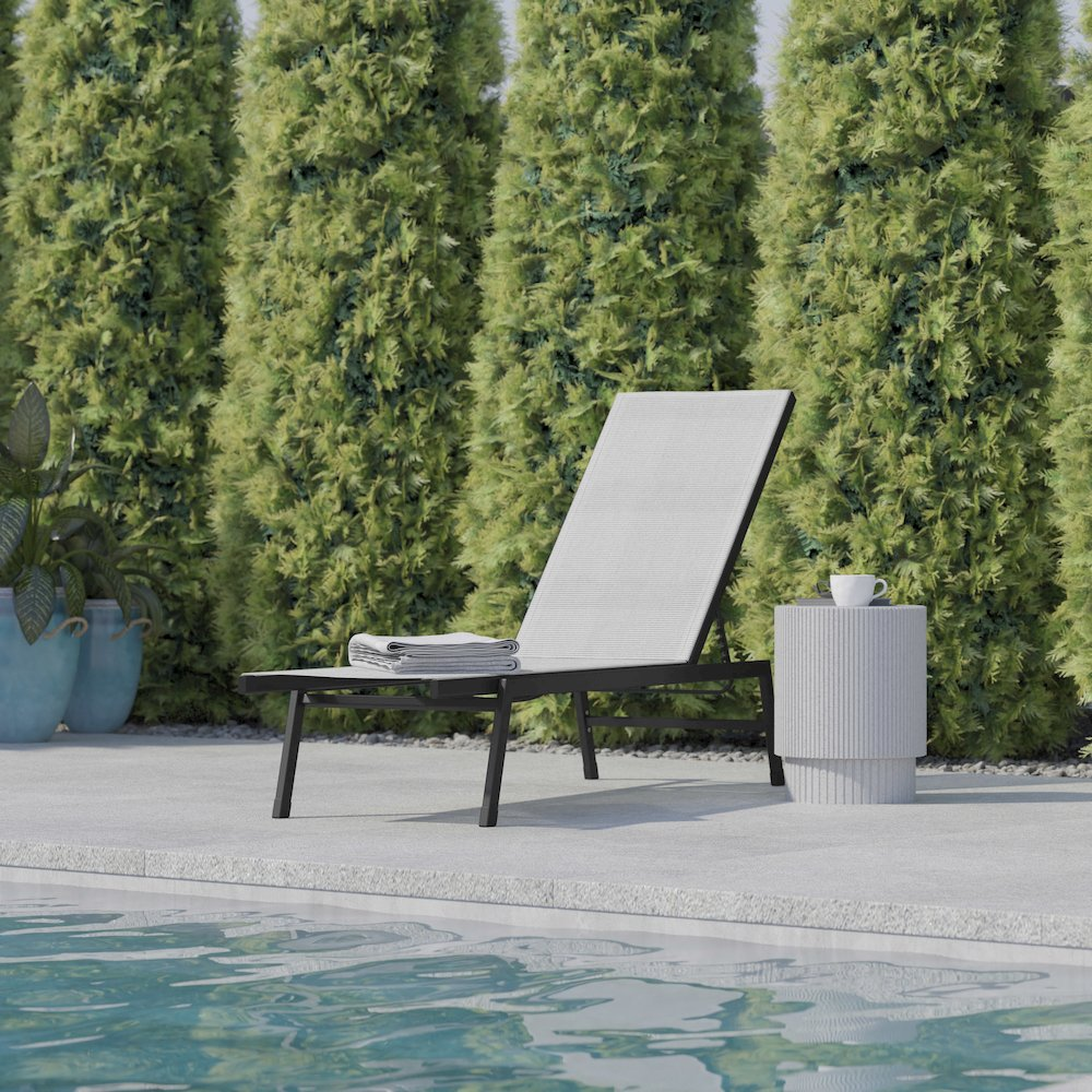 Modern outdoor chaise lounge chair by Start2Finish with a sleek design and cushioned seating for relaxing outdoors.