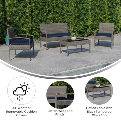 Contemporary outdoor seating set by Start2Finish with a sofa, armchair, and glass-topped coffee table on a patio.