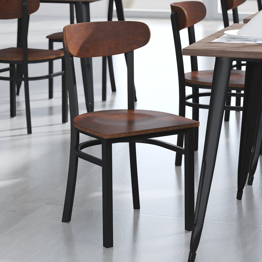 Commercial grade dining chair with solid wood back and seat, featuring a sturdy wooden frame and classic design.