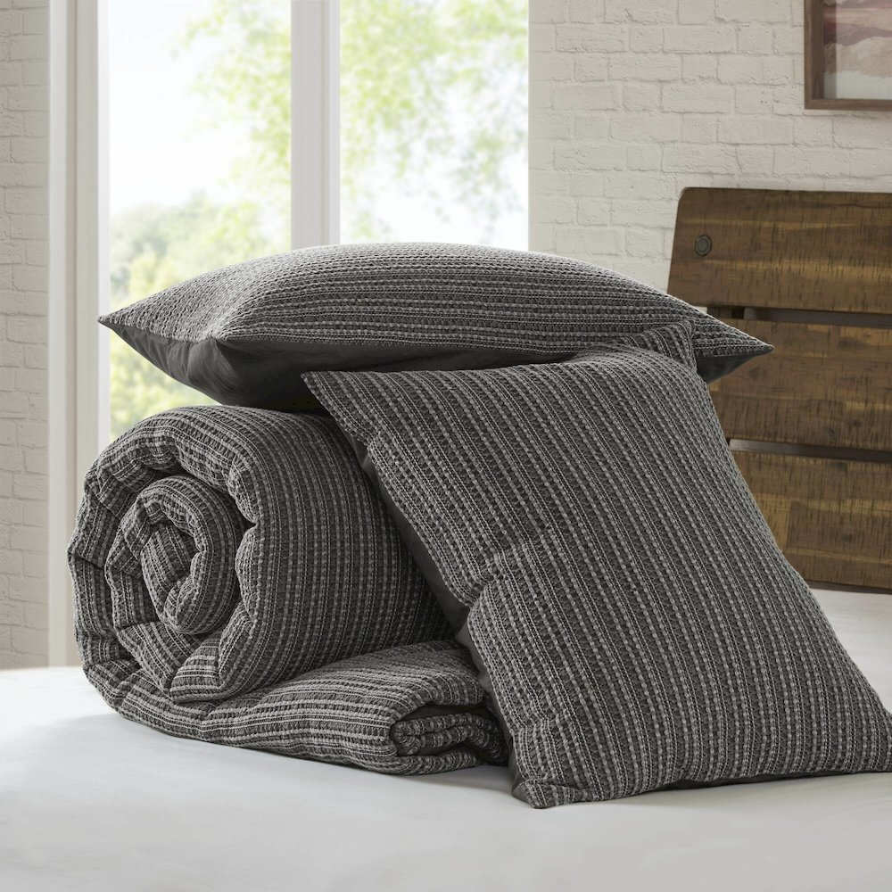 Lyon Waffle Washed Comforter Set in charcoal color by Start2Finish, featuring a textured waffle fabric design on the comforter and pillow shams.
