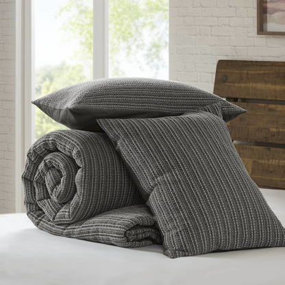 Lyon Waffle Washed Comforter Set in charcoal color by Start2Finish, featuring a textured waffle fabric design on the comforter and pillow shams.