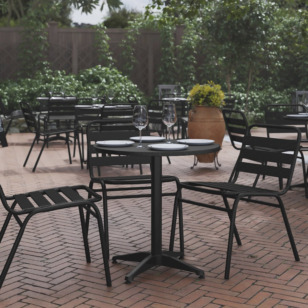 Start2Finish round patio table for restaurants and banquet halls, showing a sturdy outdoor furniture piece with a smooth surface.