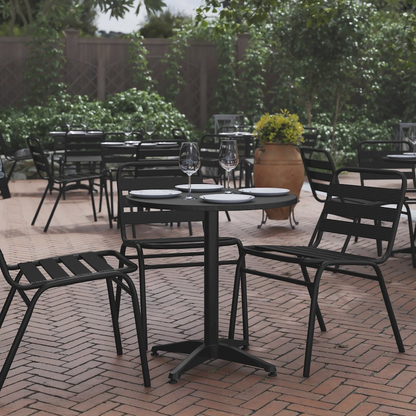 Start2Finish round patio table for restaurants and banquet halls, showing a sturdy outdoor furniture piece with a smooth surface.