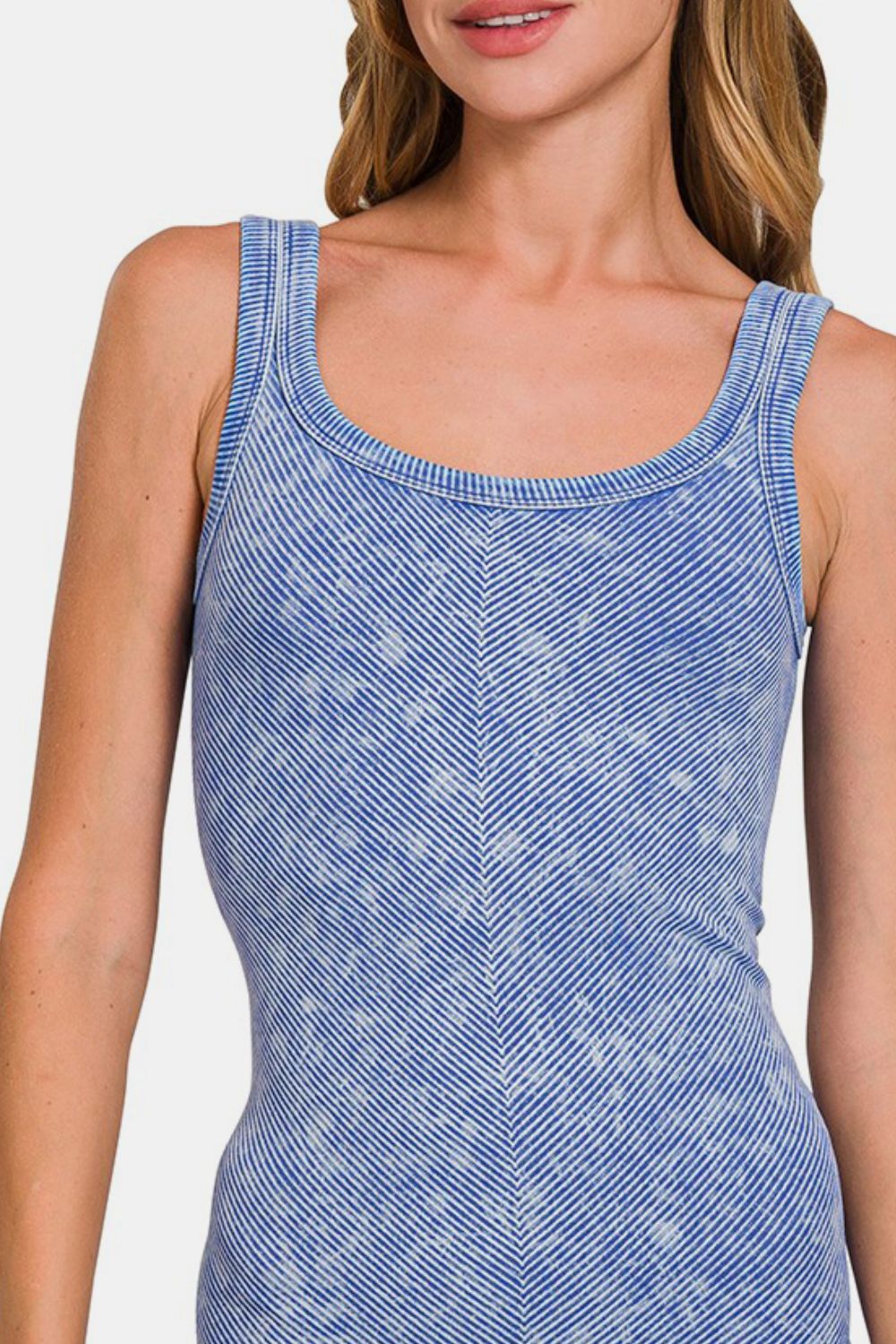 Ribbed scoop neck tank top in jade green by Jade Icarus, displayed on a mannequin with automotive-themed background.