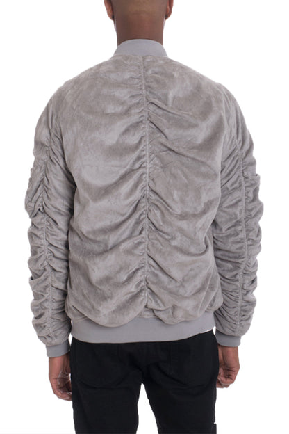 Grey Smoke faux suede Lime Milo bomber jacket with tagged design, showing front view with zipper and collar detail.