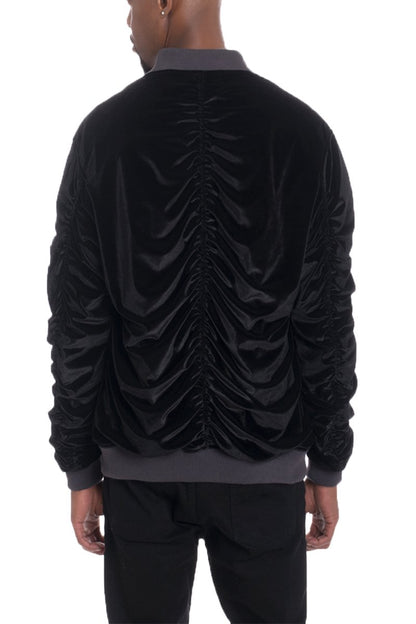 Lime Milo velour cinch sleeve bomber jacket in black with ribbed cuffs and collar, displayed on a hanger.