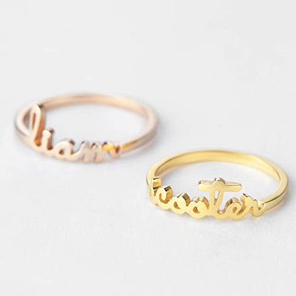Green Millie stackable mother rings with minimalist design, featuring multiple gold-tone rings stacked together.