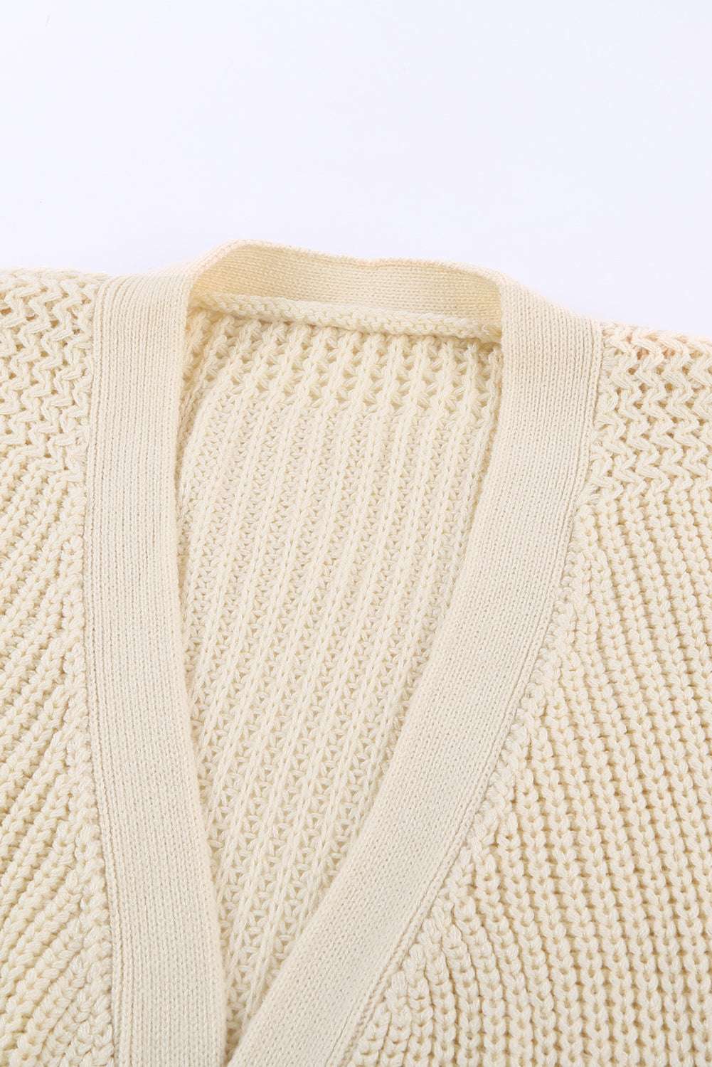 Beige wrap V-neck sweater with side tie from Harlequin Daisy, ideal for bath and beauty comfort and casual wear.