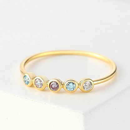 Green Millie birthstone ring featuring multiple colorful gemstones representing children’s birthstones in a silver band.