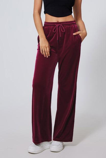 Burgundy solid drawstring waist wide-leg pants by Carmine Juneberry, featuring a relaxed fit and comfortable fabric.