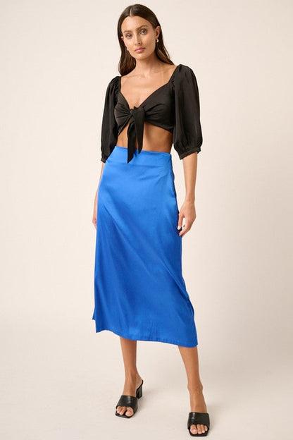 Jade Icarus Mittoshop satin midi skirt with side slit, showcasing smooth fabric and stylish design.