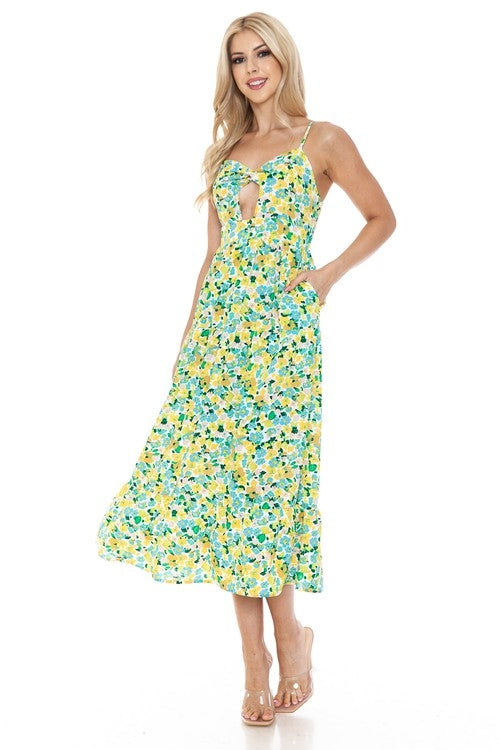 Women’s floral maxi dress by Jade Icarus featuring a flowing fabric, vibrant flower print, and sleeveless design.
