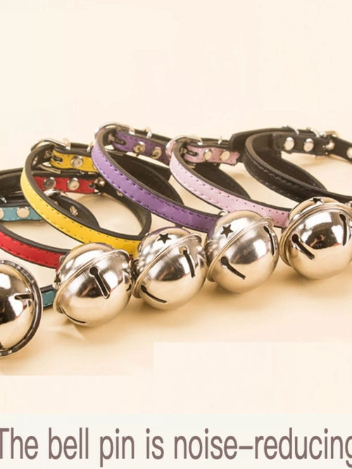 Leather pet collar with bell from Pear Daisy, featuring durable brown leather and a small metal bell for pets.