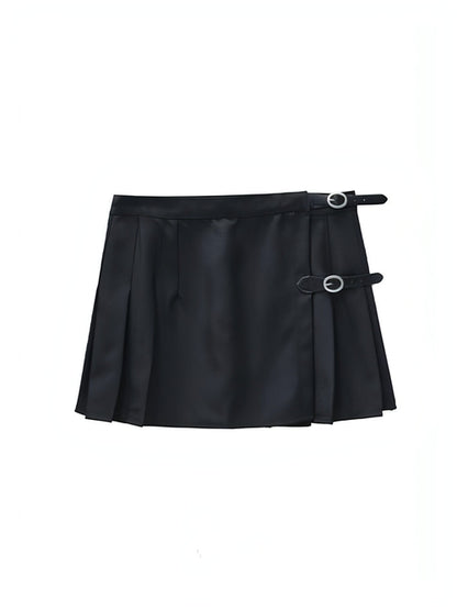Carmine Juneberry pleated skirt in soft fabric with a flowy silhouette, shown hanging on a hanger against a neutral background.