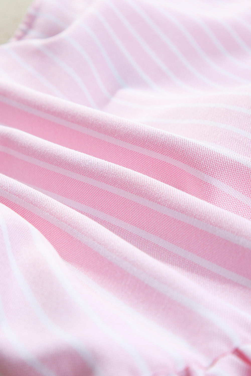 Pink stripe bowknot front blouse with puff sleeves by Carmine Juneberry, featuring a crew neck and feminine design.