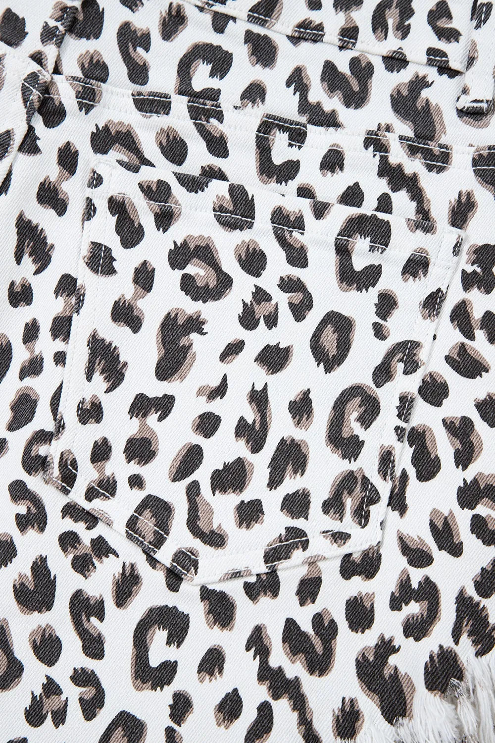 Leopard print frayed hem denim shorts for women by Ruby Styx, showing the stylish distressed hem and animal print pattern.