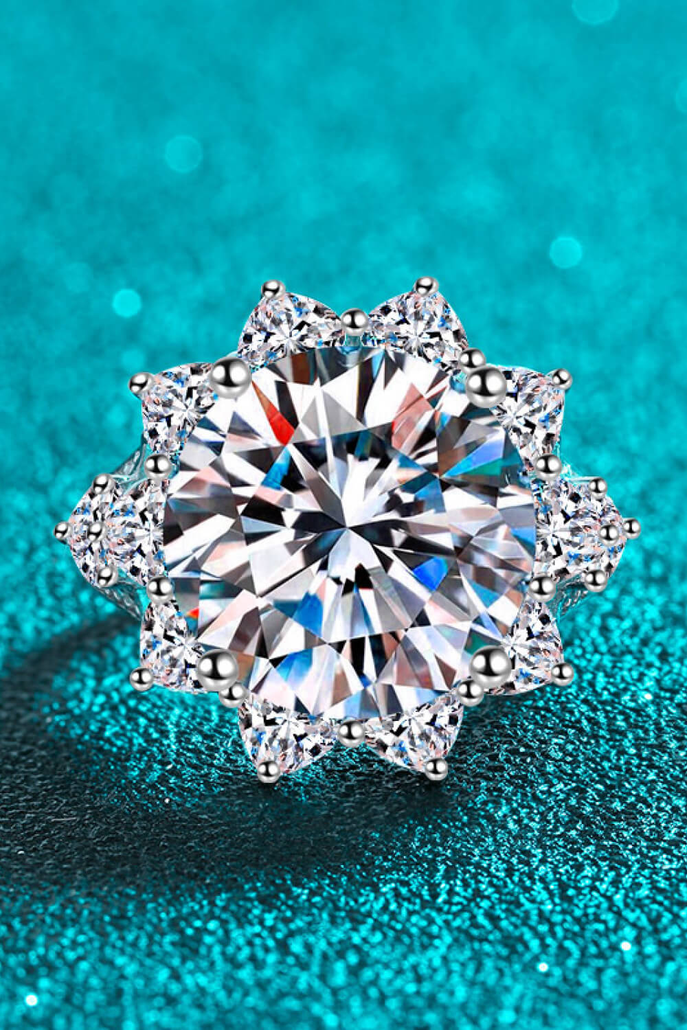 Pear Daisy 10 Carat Moissanite flower-shaped ring with intricate petal design, perfect for jewelry or home decor displays.