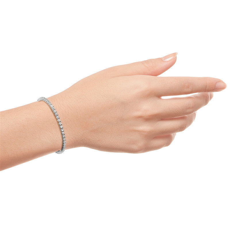 Three moissanite tennis bracelets with 3mm stones in white, yellow, and rose gold overlay, showcasing elegant jewelry craftsmanship.