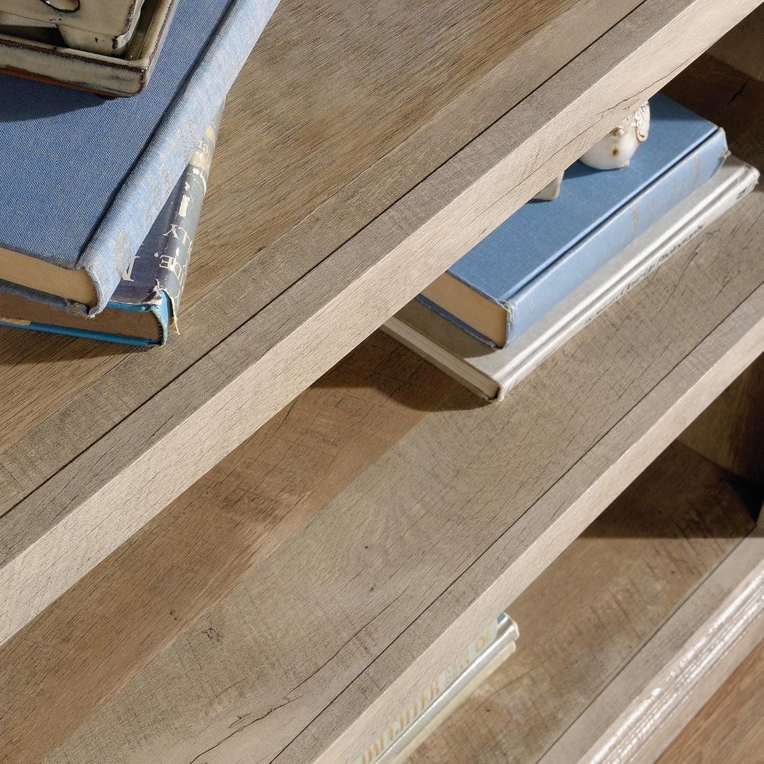 Peach Maple 3-shelf bookcase in lintel oak finish, showcasing a modern furniture piece with spacious shelves for living room storage.