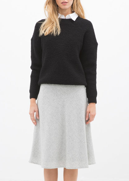 High waisted wool knit midi skirt in Heather Grey by Lemon Hera, showcasing a stylish, cozy wool fabric and flattering silhouette.