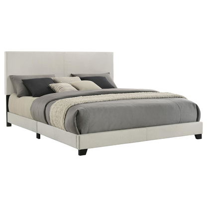 Eastern King panel bed with cream fabric upholstery and simple design, featuring a padded headboard and clean-lined frame.