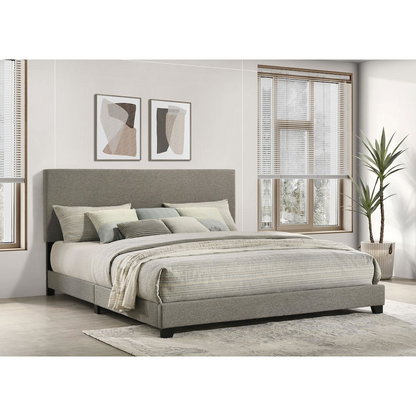 Eastern King panel bed with taupe fabric upholstery and clean-lined design from Start2Finish, shown in a modern bedroom setting.