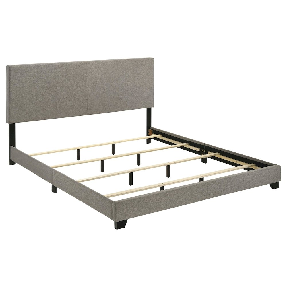 Taupe fabric upholstered California King panel bed with clean lines and a modern design, featuring a sturdy wooden frame and headboard.