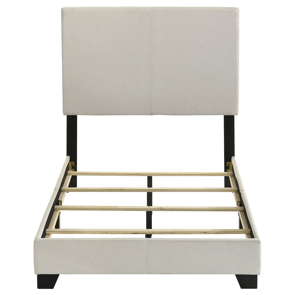 Cream fabric upholstered twin panel bed by Start2Finish with a modern design and padded headboard for a stylish bedroom look.