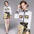 Carmine Juneberry SweetCharm™ 2-piece long sleeve top and mini skirt set featuring a stylish matching design and vibrant color.