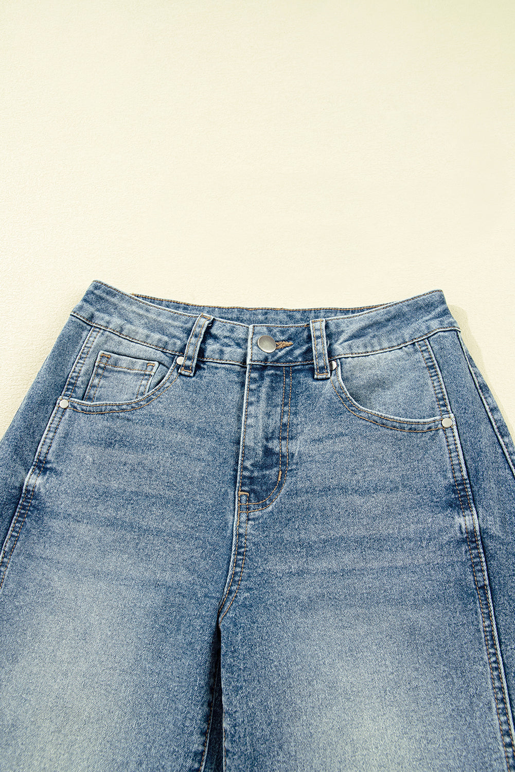 Vintage washed denim shift jeans for women by Byzantium Bay, showcasing classic seam details and relaxed fit.