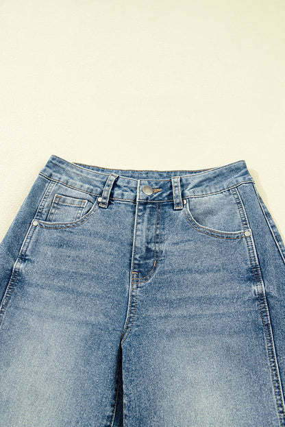Vintage washed denim shift jeans for women by Byzantium Bay, showcasing classic seam details and relaxed fit.