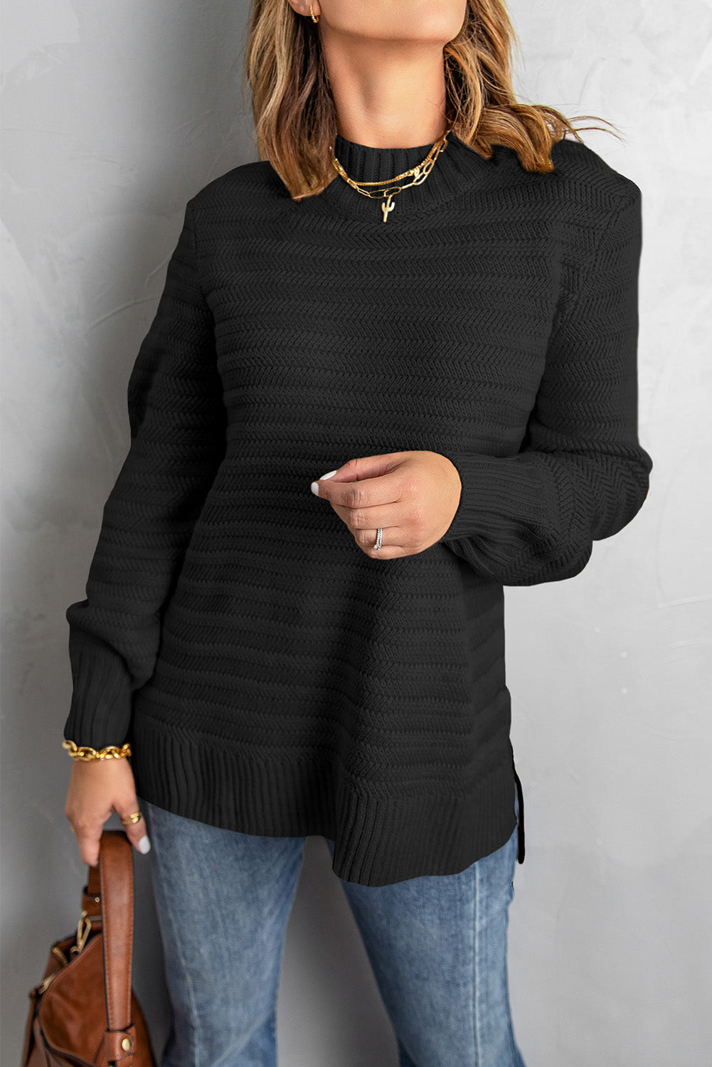 Black solid color textured sweater with stand collar from Harlequin Daisy, designed for bath and beauty comfort.