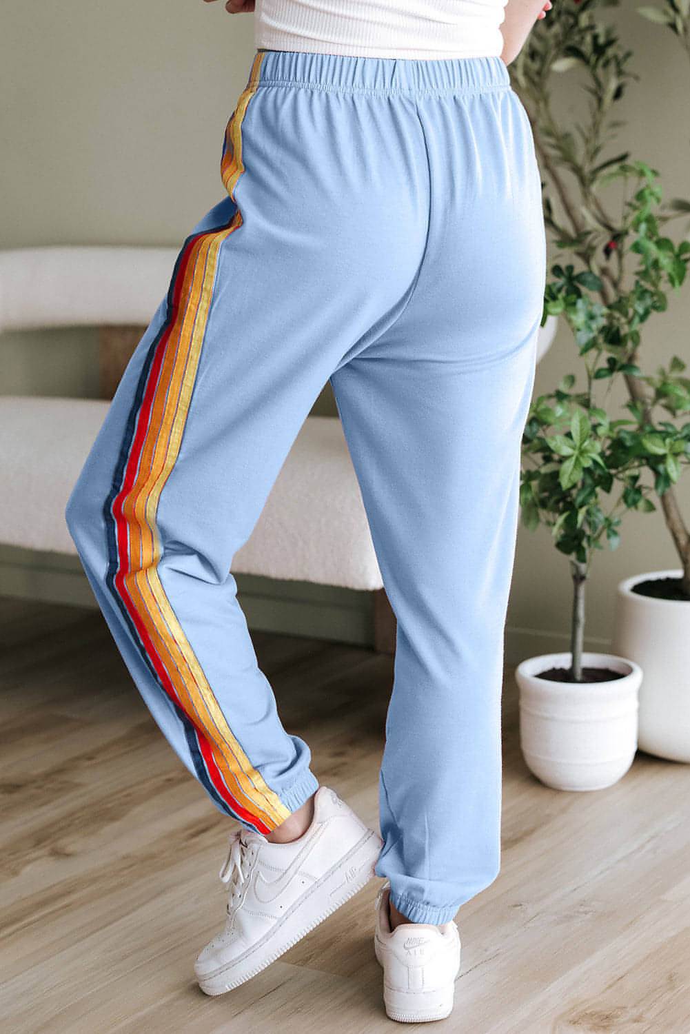 Light blue counting rainbows high waist sweatpants by Carmine Juneberry, featuring rainbow details and comfortable fit.