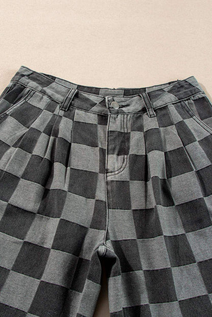 Dark grey checkered denim wide-leg pants by Carmine Juneberry, showing the relaxed fit and stylish pattern.