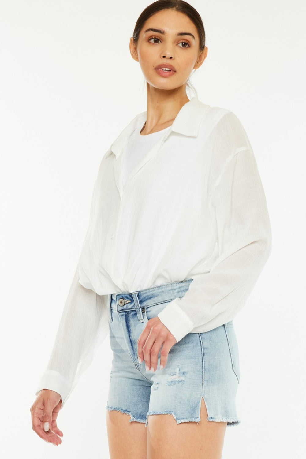 Jade Icarus Kancan high rise side slit denim shorts with distressed details and frayed hems, casual summer style.