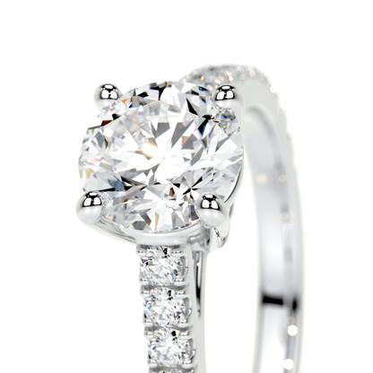 Round brilliant lab-grown diamond channel engagement ring in 14K white gold with F/VS quality, featuring multiple sparkling diamonds.