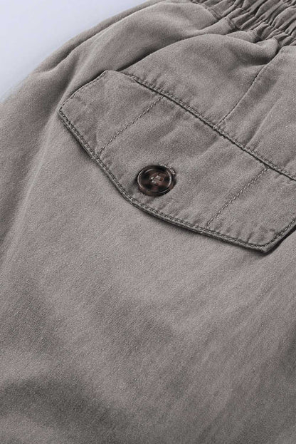Gray drawstring cargo pocketed joggers for women by Lavender Pallas, featuring a relaxed fit with side pockets and adjustable waist.
