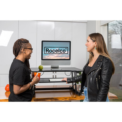 Start2Finish Rocelco 32-inch height adjustable standing desk with a sleek wooden surface and sturdy metal frame.