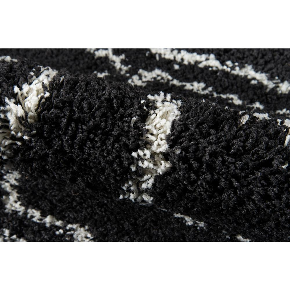 Black contemporary rectangle area rug measuring 5&