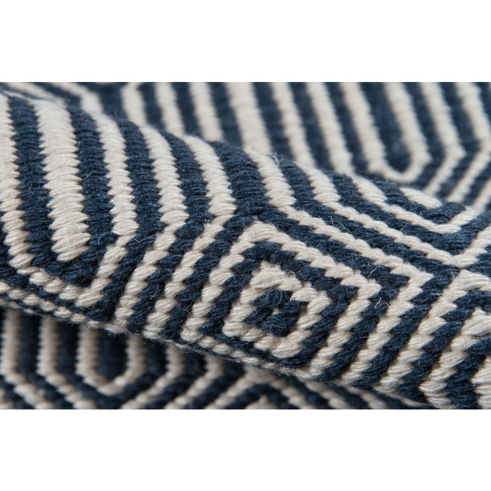 Navy rectangular area rug from Start2Finish with a contemporary design, measuring 5 by 7.6 feet, shown on a neutral floor.