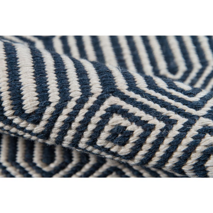Navy rectangular area rug from Start2Finish with a contemporary design, measuring 5 by 7.6 feet, shown on a neutral floor.