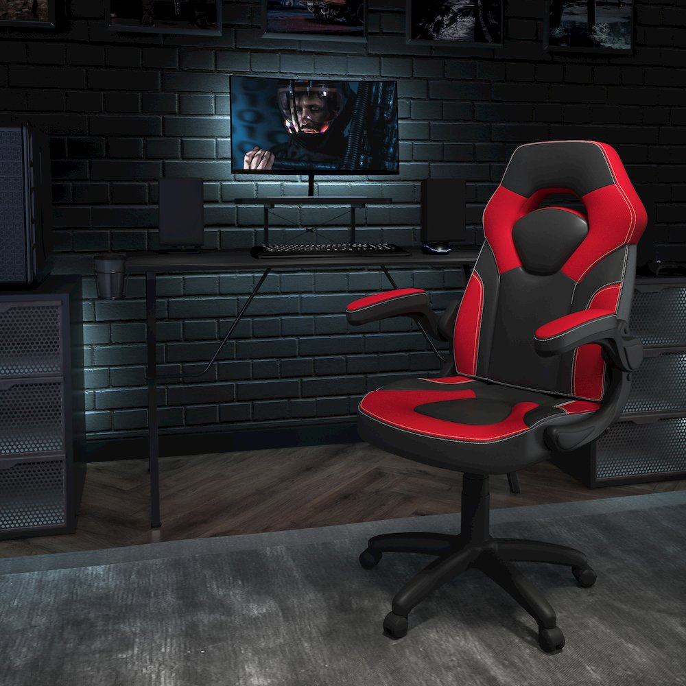 Start2Finish black gaming desk with red and black racing chair, featuring a sleek gaming setup with adjustable chair and spacious desk surface.
