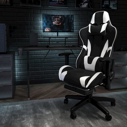 Start2Finish black gaming desk and reclining gaming chair set with a black footrest, featuring sleek, modern furniture design.