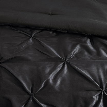 Start2Finish Laurel 7-piece tufted black bedding comforter set with decorative pillows on a bed.