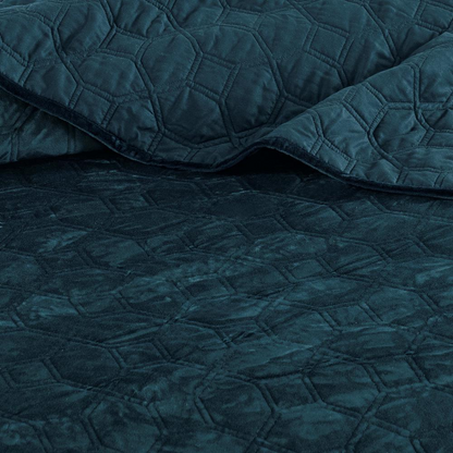 Start2Finish Harper 3-piece velvet quilt set in teal, featuring a cozy quilt and matching pillow shams on a bed.