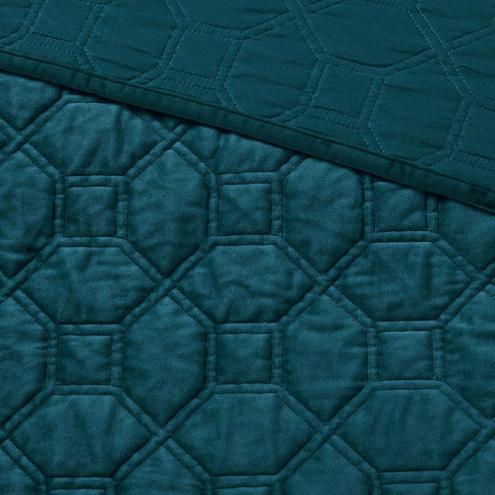 Start2Finish Harper 3-piece velvet quilt set in teal with matching pillow shams on a bed, showcasing luxurious textured fabric.