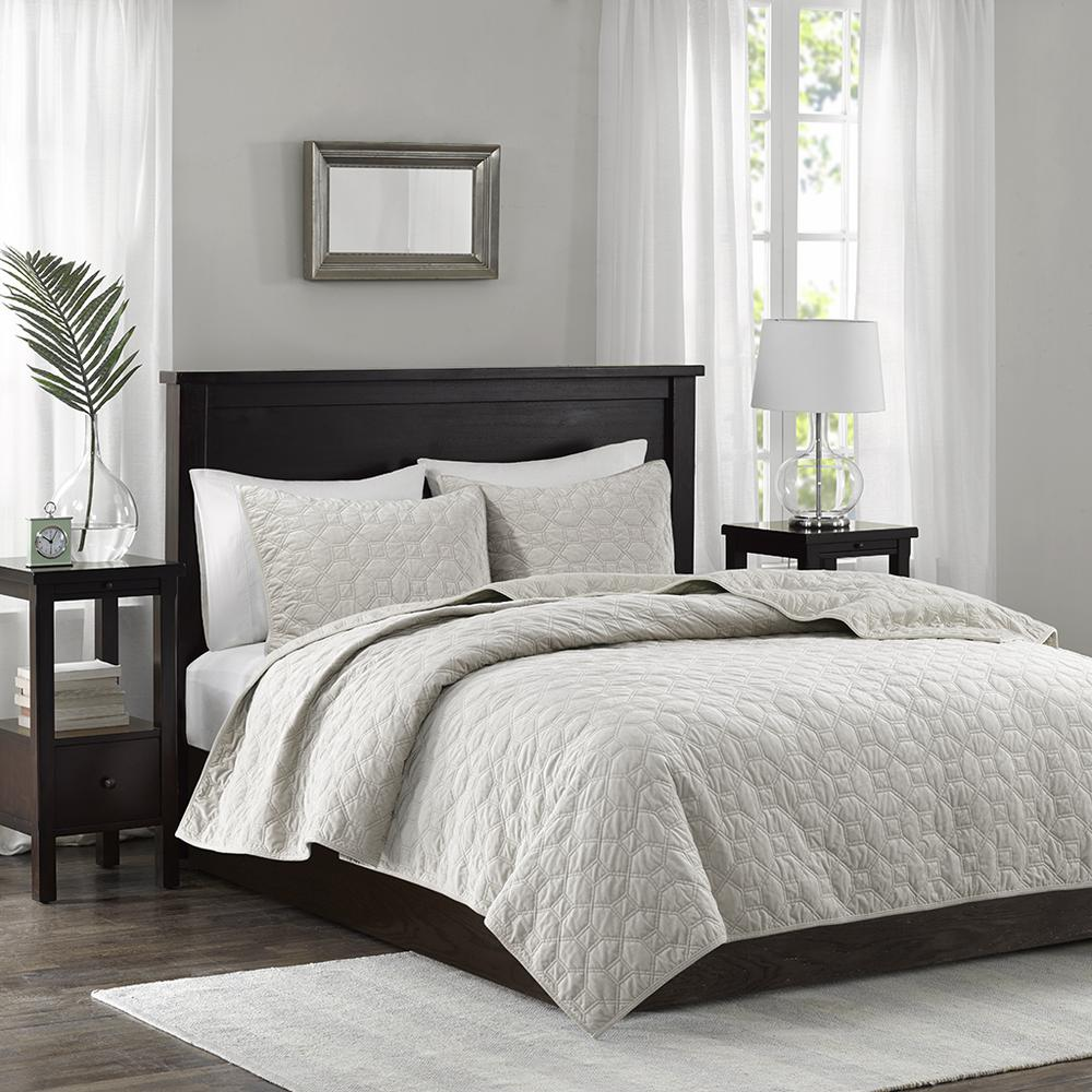 Start2Finish Harper 3-piece velvet quilt set in ivory, showing the soft quilt and matching pillow shams on a bed.