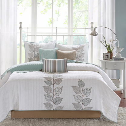 Start2Finish 6-piece embroidered quilt bedding set with matching throw pillows, showcasing intricate stitching and cozy design.