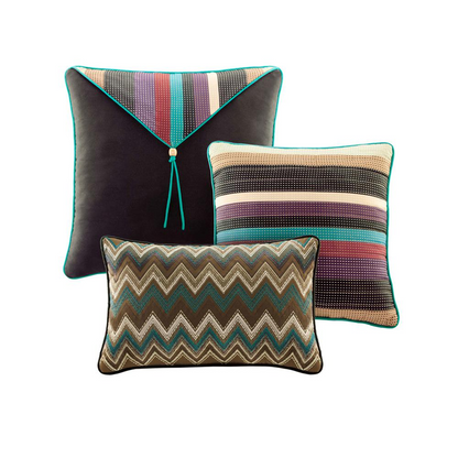 Start2Finish Yosemite reversible quilt bedding set with colorful throw pillows, showcasing multi-color patterns on a bed.